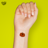 Tatouage éphémère Halloween coloré motif citrouille souriante